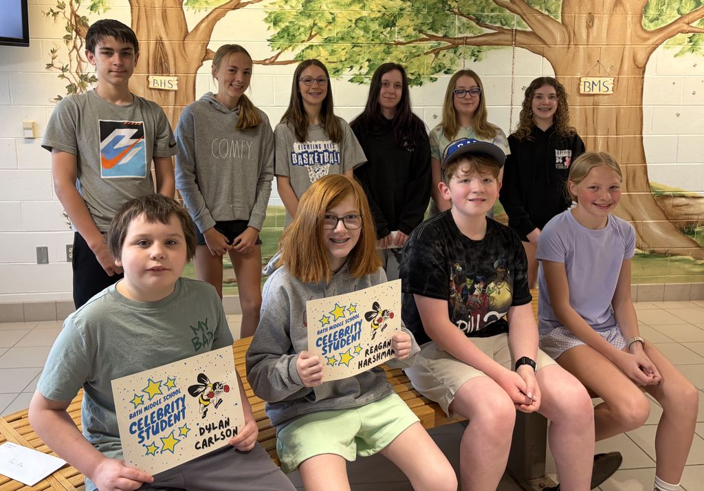 Group of students, some holding certificates