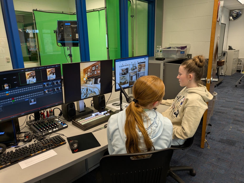 Girls sitting at control panel