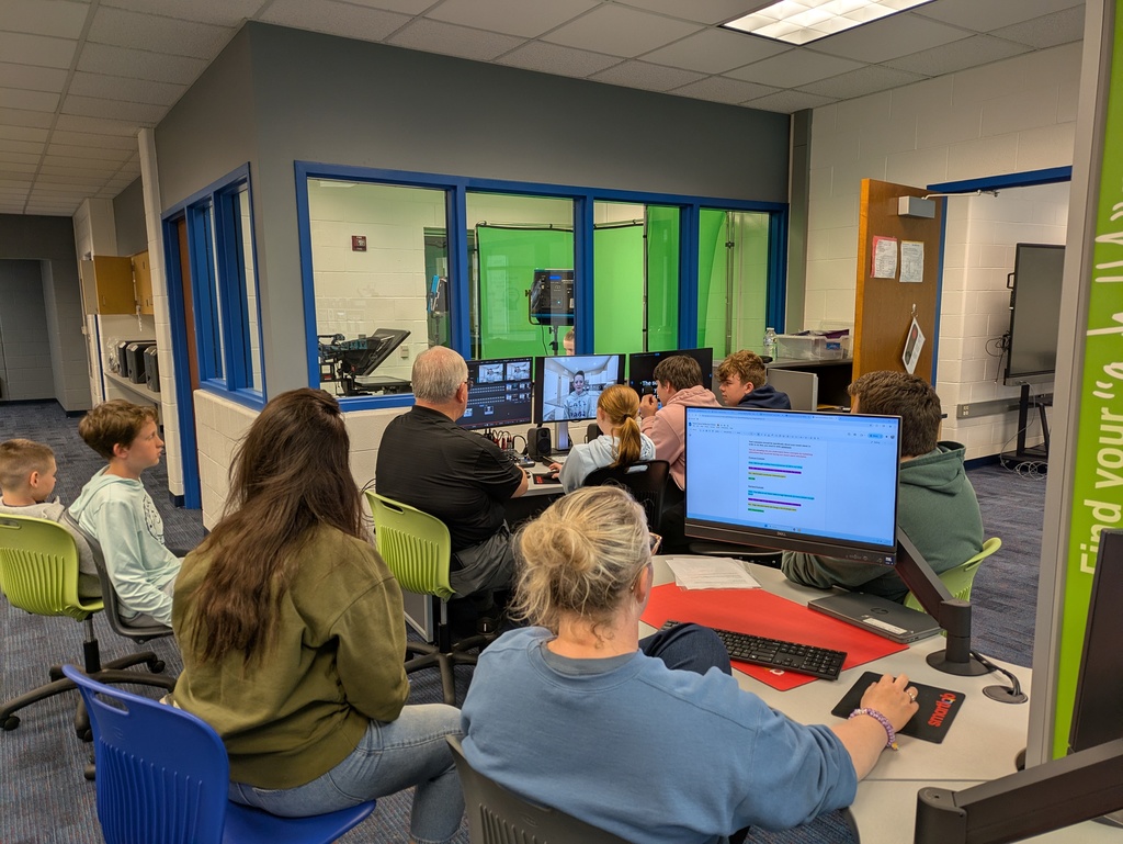 Students watching while recording a news video