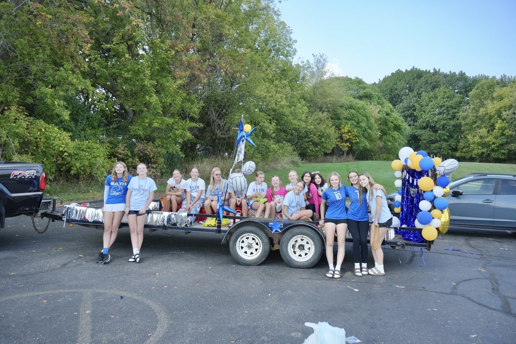 Middle School volleyball team on homecoming float