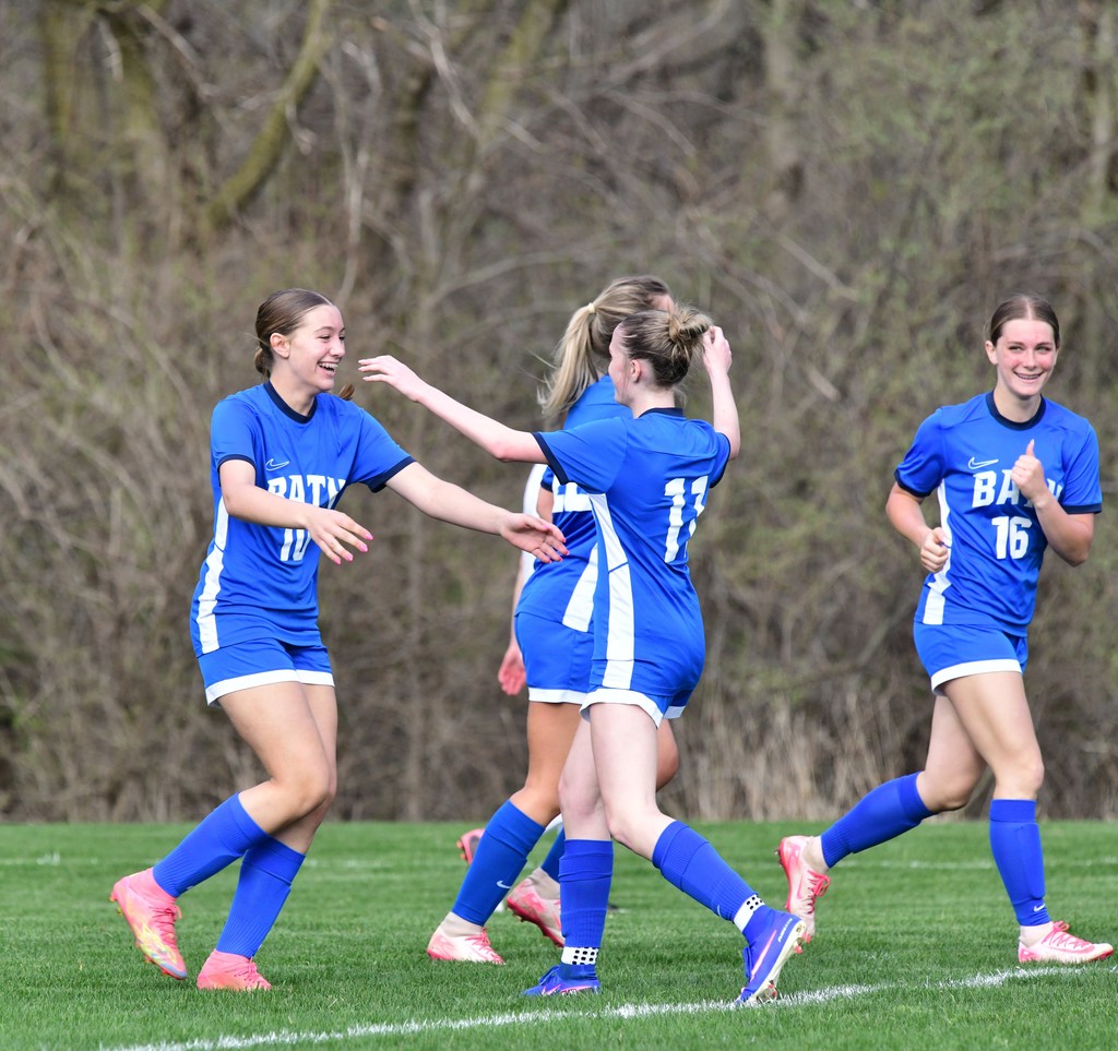 Girls soccer player celebrating