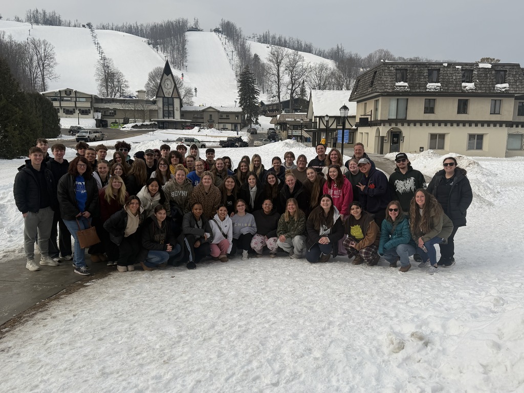 Senior Class trip at Boyne Mountain. Students standing in front of the lodge.