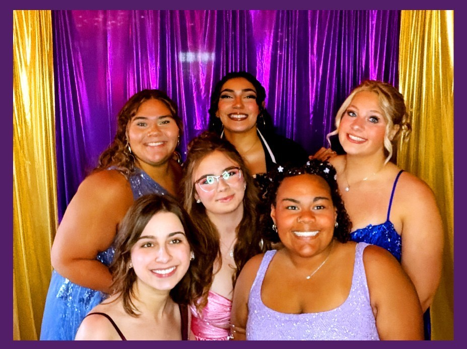 Girls at prom in photo booth