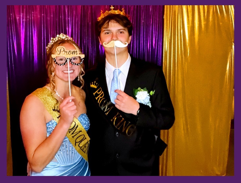 Prom king and queen in photo booth
