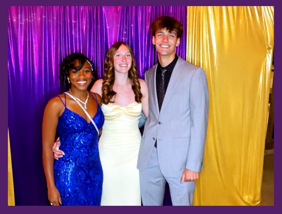 Students at prom in photo booth