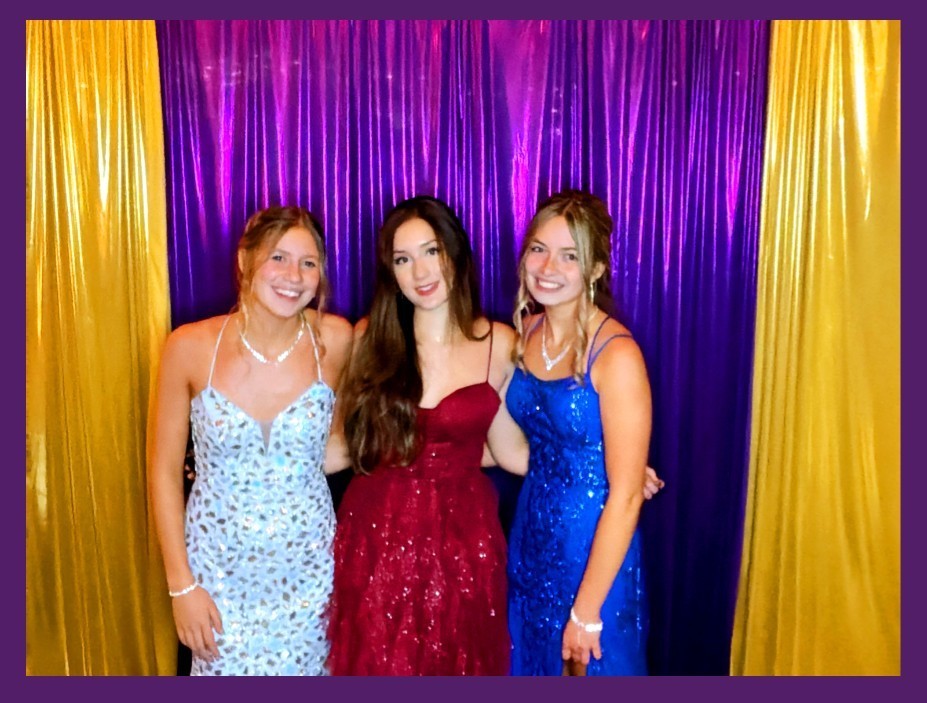 Girls at prom in photo booth
