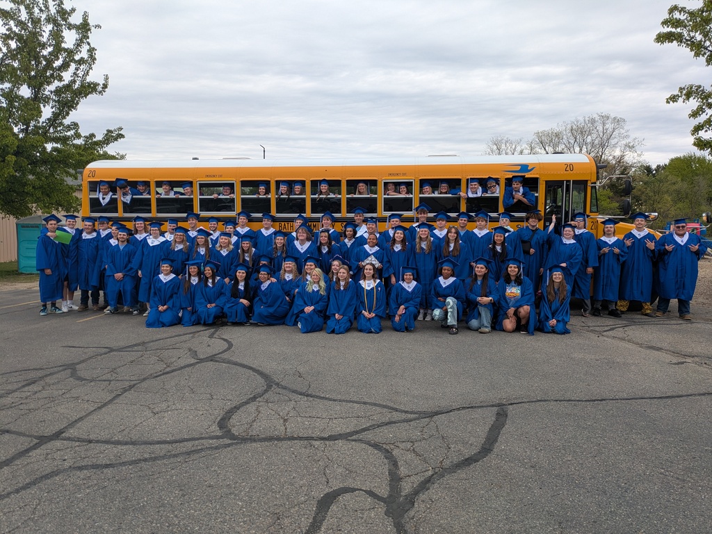 Seniors in front of the school bus