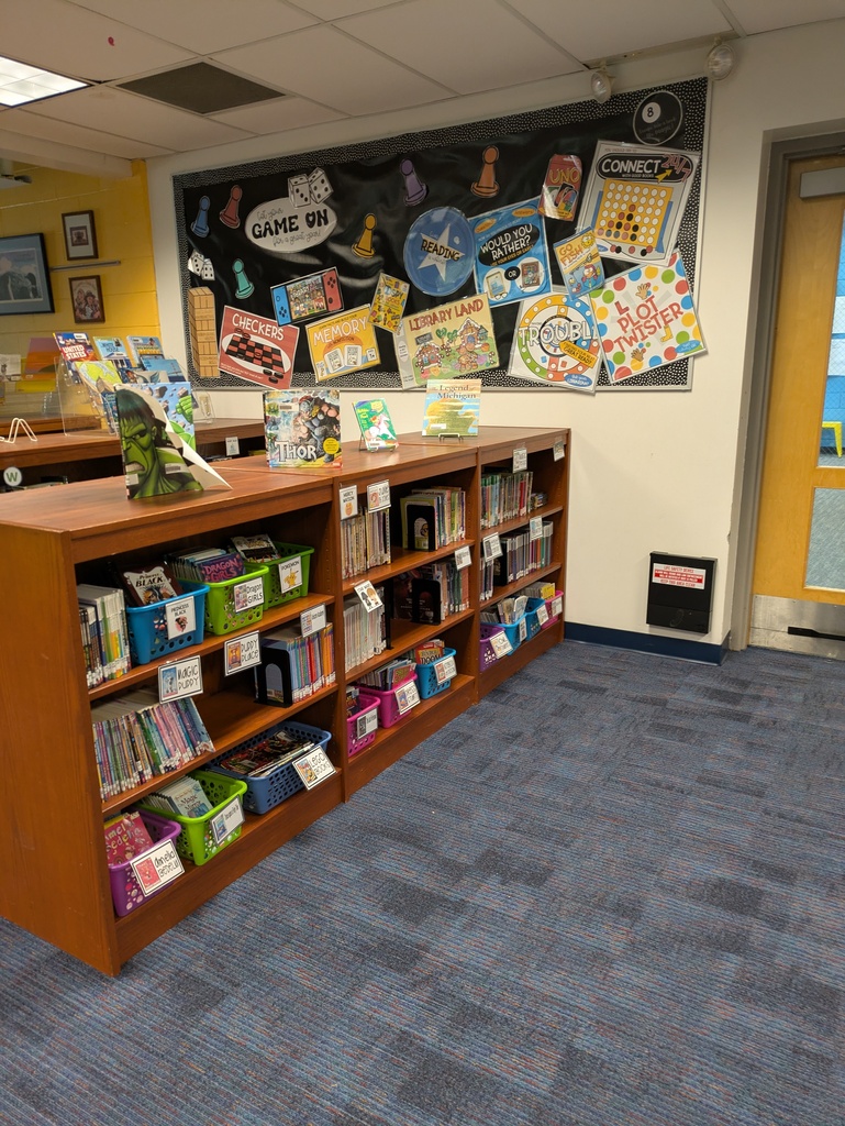 Books sitting on shelves in the library
