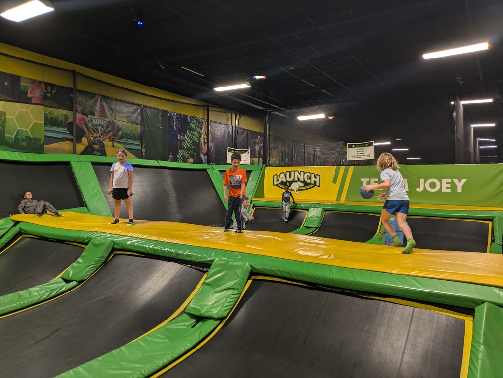 Kids playing dodgeball on trampoline
