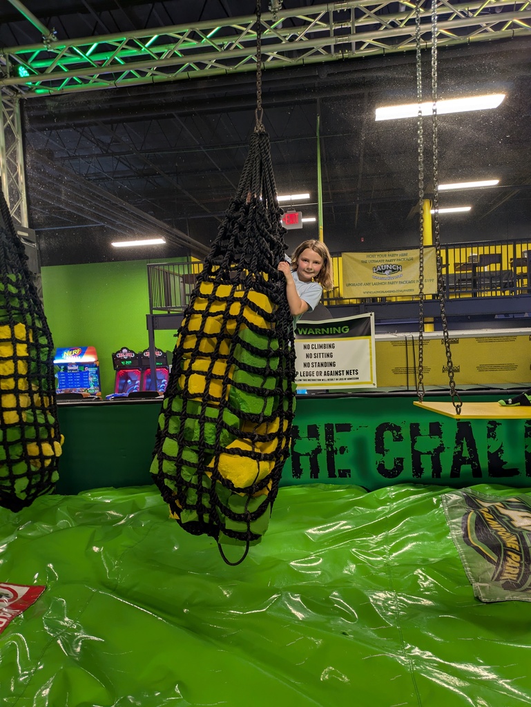Girl hanging from ropes