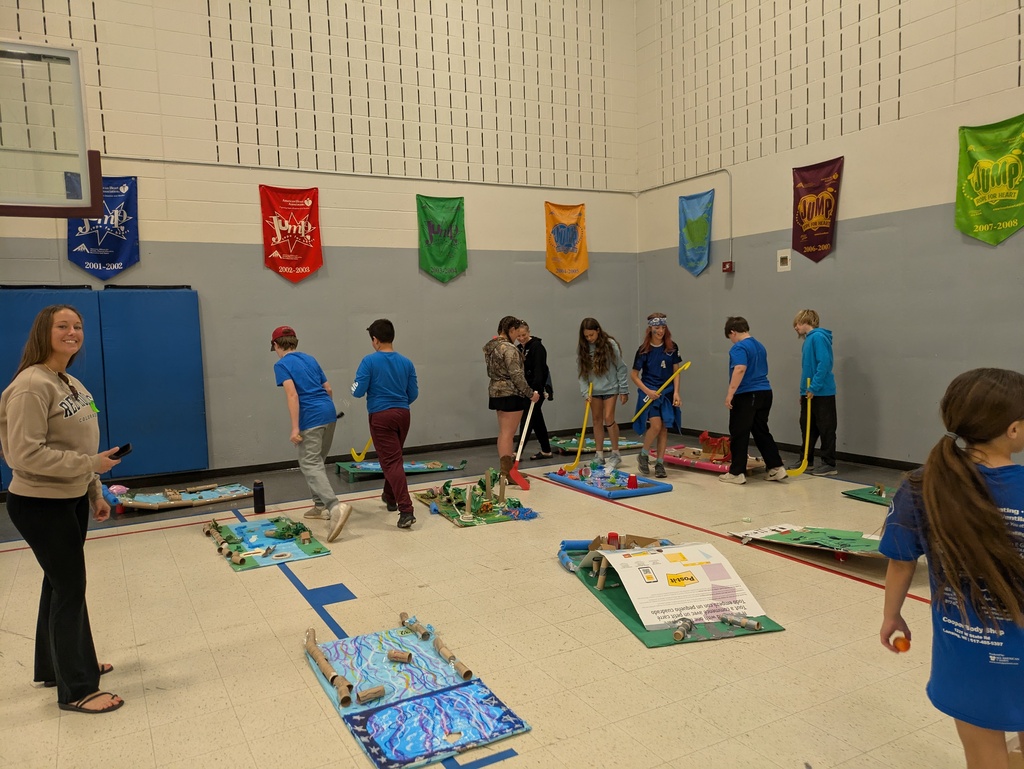 Studens and parents standing around the course