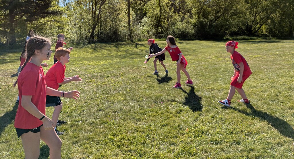 Students participating in a water balloon toss