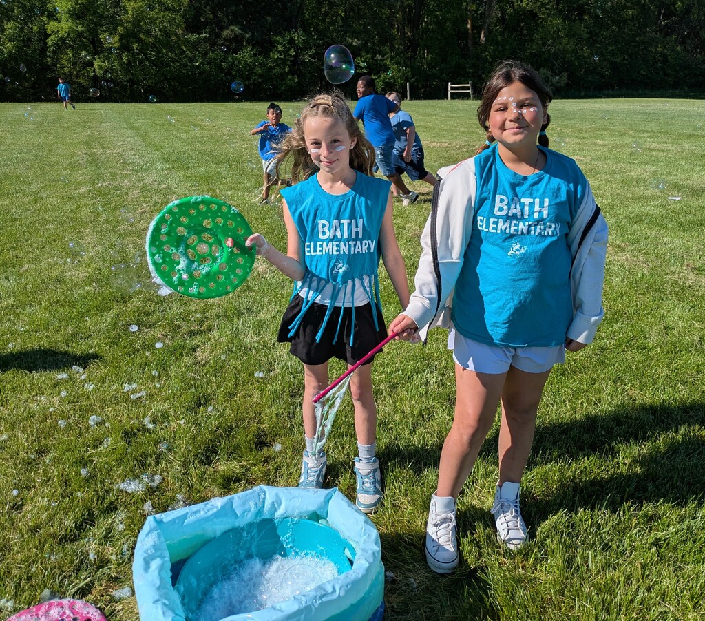 Girls holding bubble wands