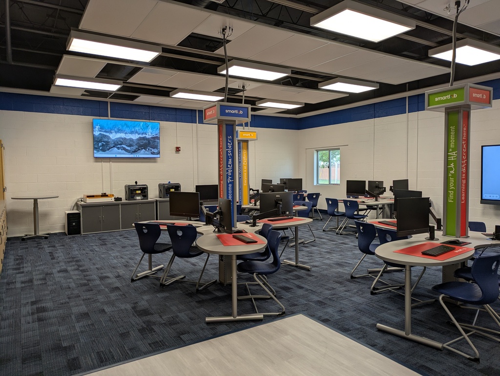Workstations and tv mounted on wall