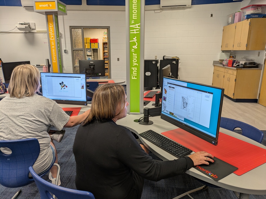 Staff members sitting at computers