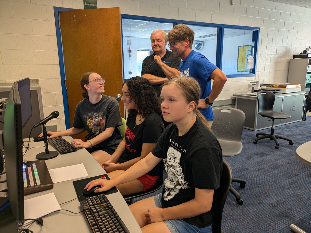 Students looking at computers