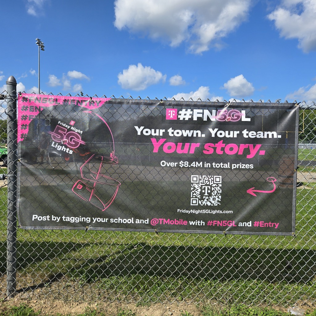 FNL TMOBILE contest contest sign and banner at entrance of football field