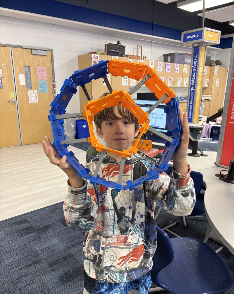 Boy holding his project