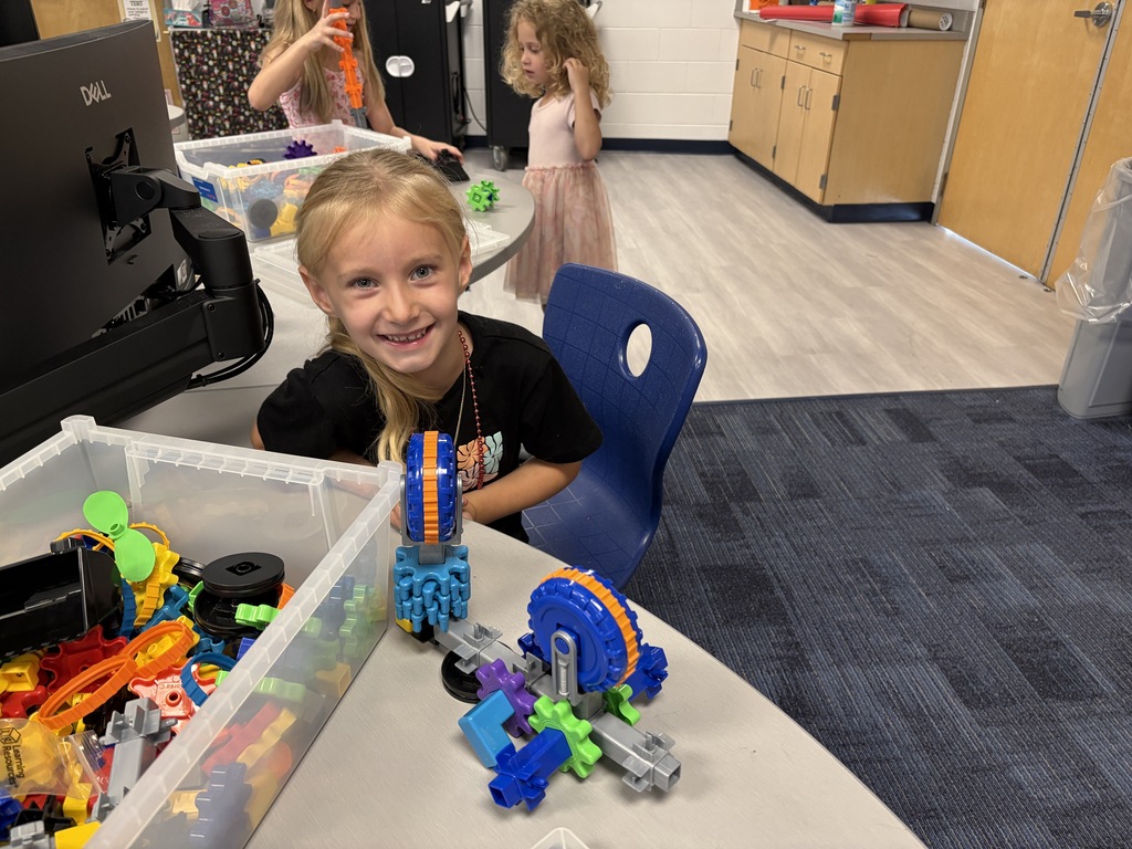 Girl sitting next to her gear project