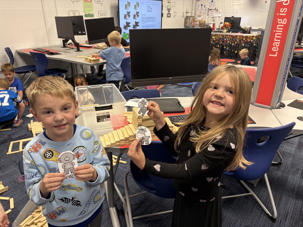 Students building with keva planks
