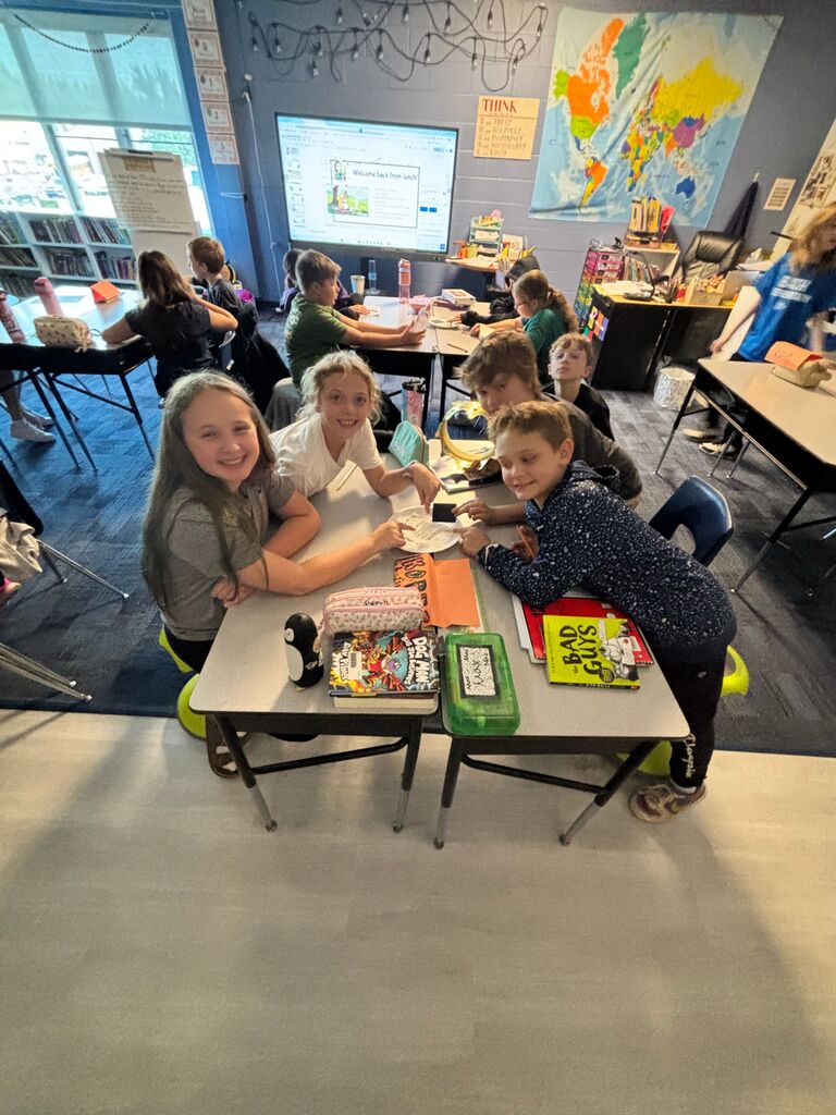 Students sitting at a table 