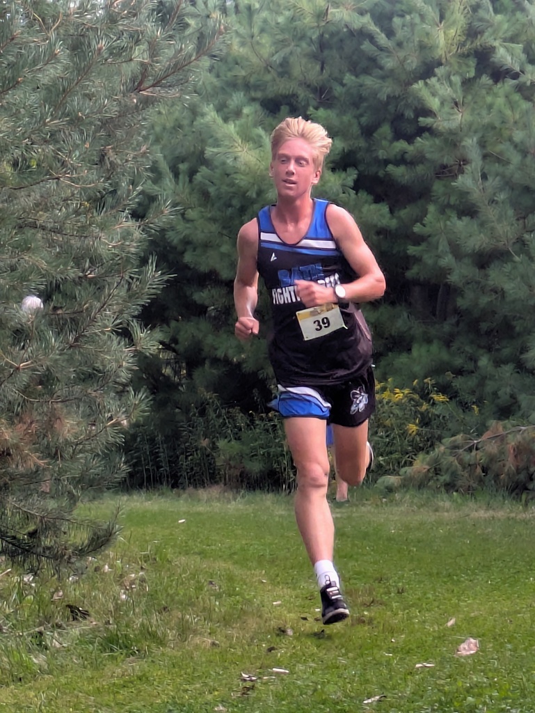 Boy wearing Bath uniform running on the grass