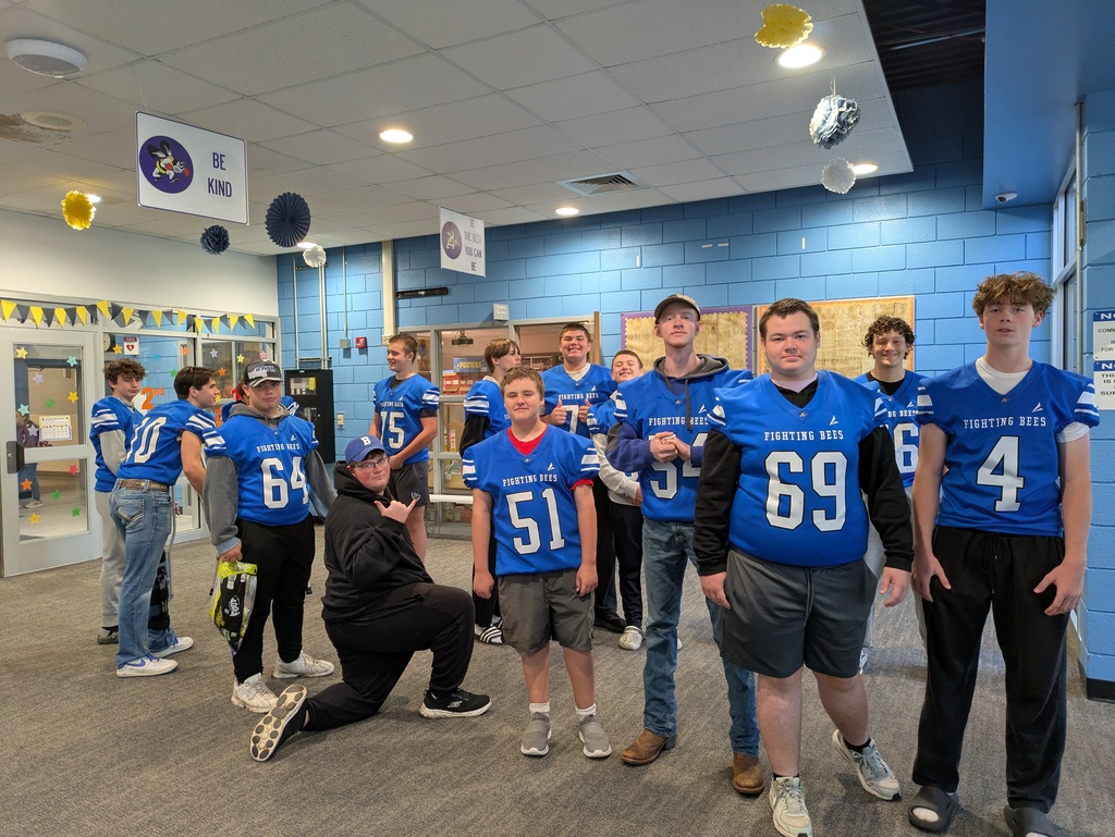 BHS football players standing in the lobby