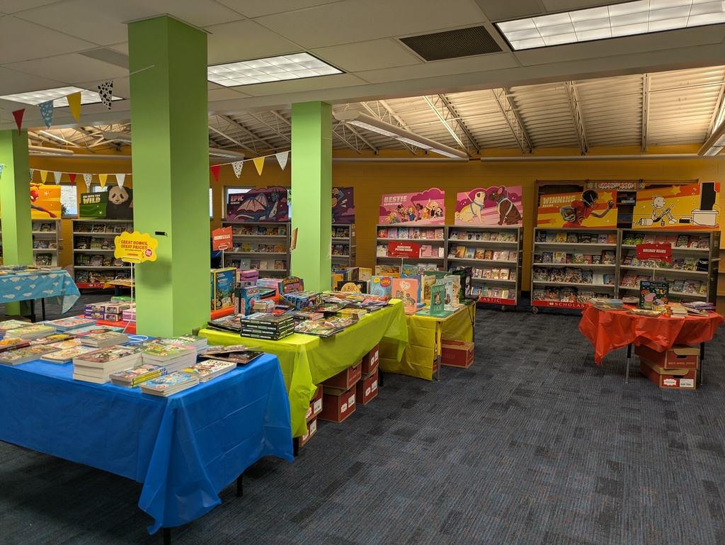 Tables and display cases with books for sale
