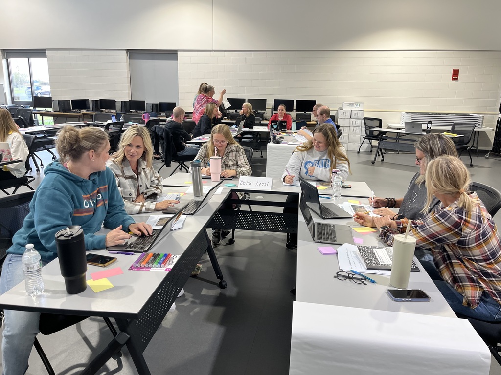 Staff in a classroom working together