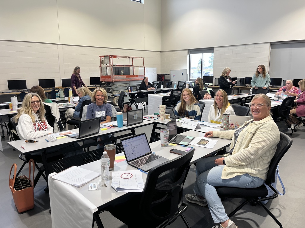 Staff in a classroom working together