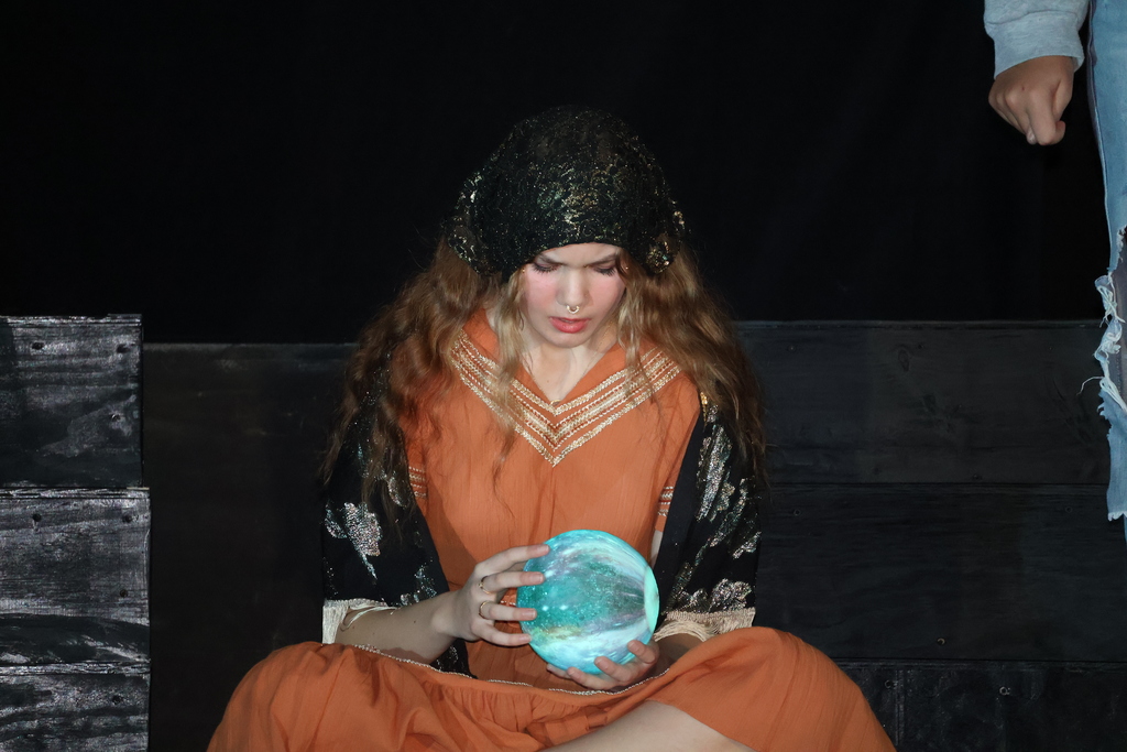 Actress looking into a crystal ball