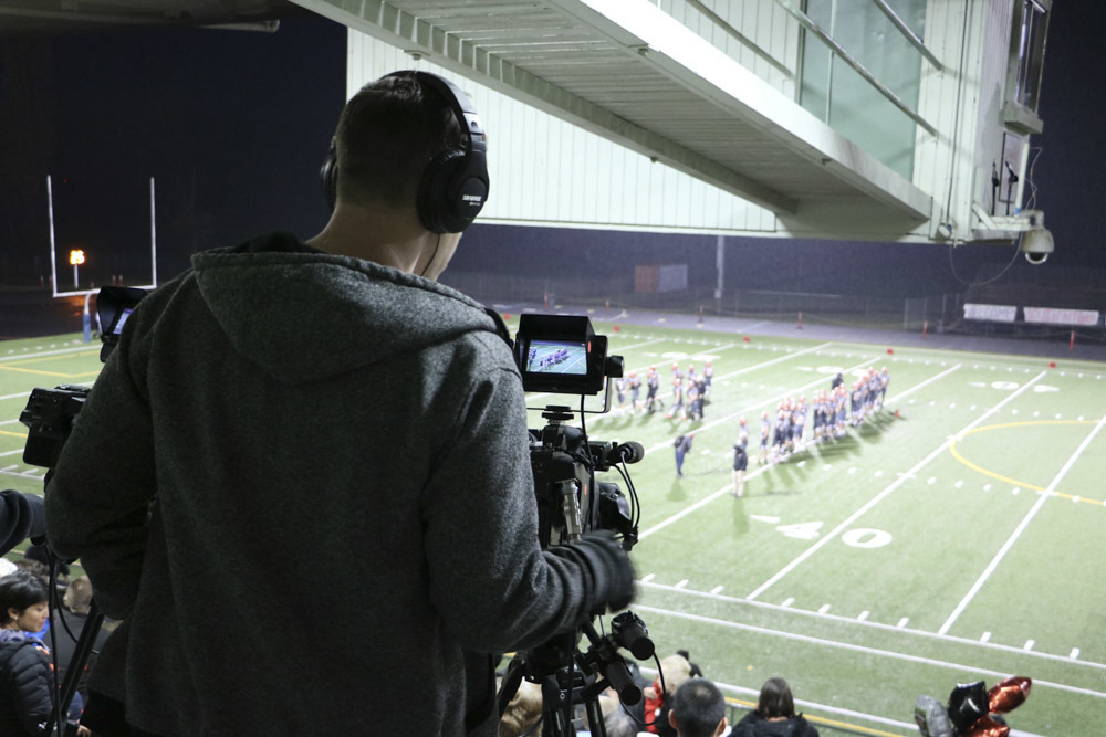 A student operating a camera