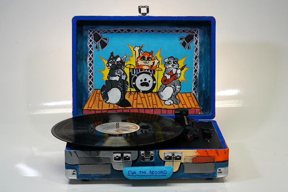 Record player with student-created cat design