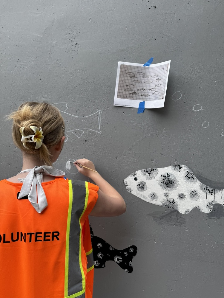 Miriam paints a fish