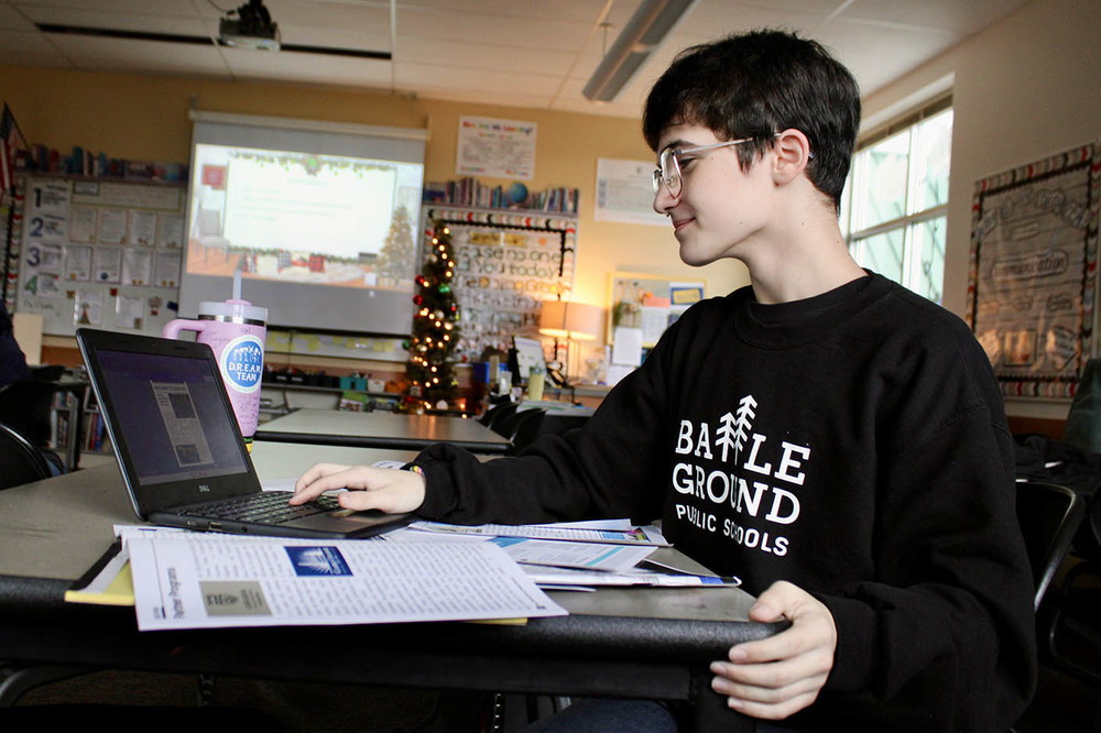 Editor Rye Dilley works on Your Battle Ground Public Schools
