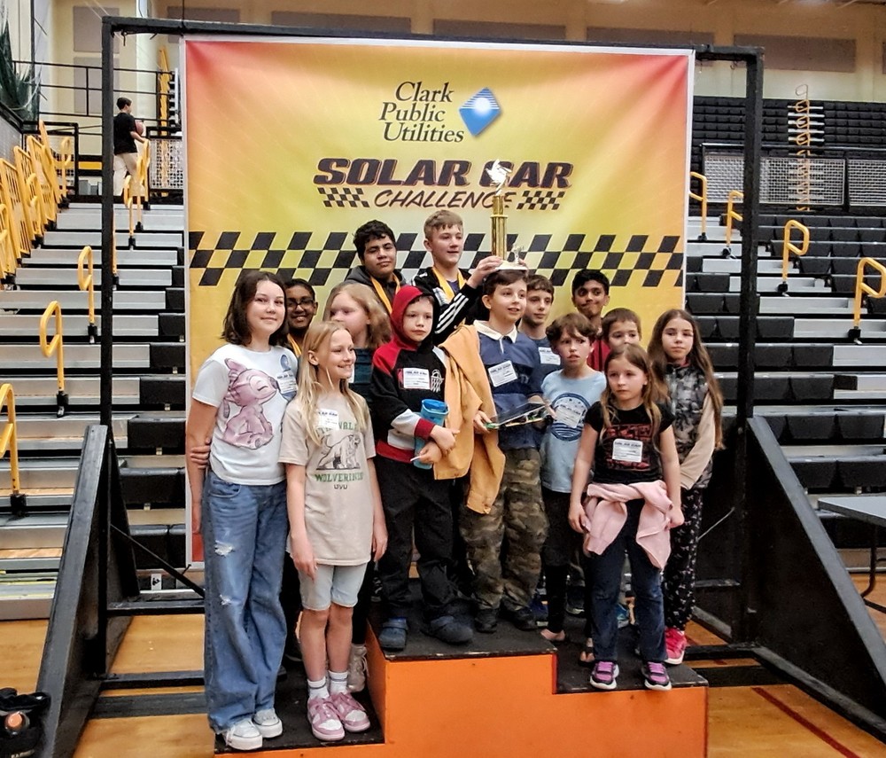 Student display their trophy at the Solar Car Challenge
