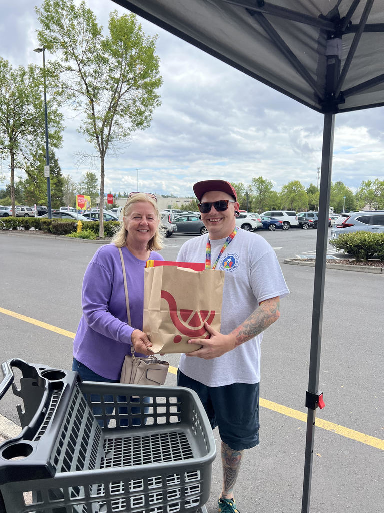 A shopper donates school supplies