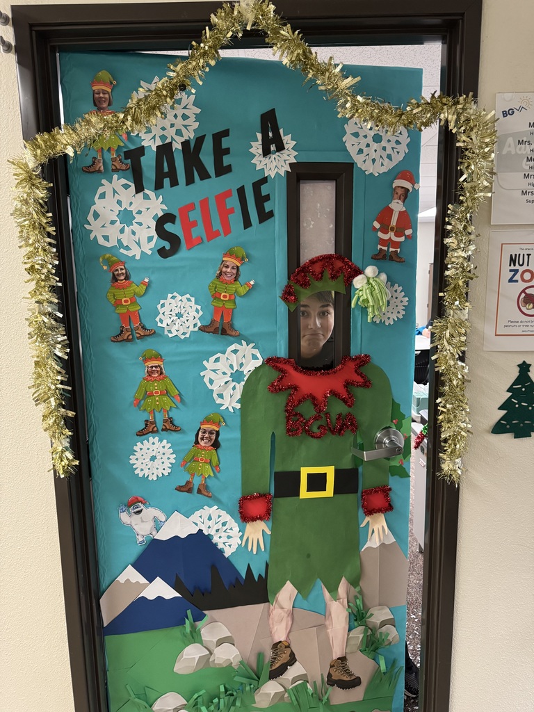 Classroom door decorated for the holidays. It reads, "Take a selfie," with the "elf" in "selfie" emphasized.