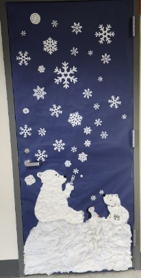 Classroom door decorated with polar bears blowing snowflake bubbles.