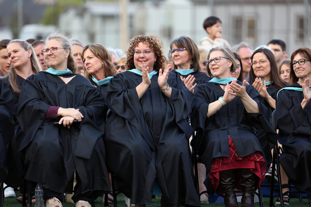 Teachers clap for the class of 2026