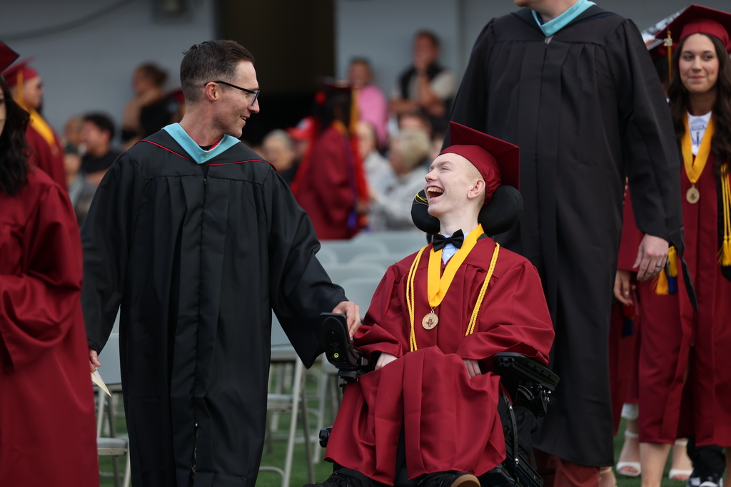 A graduate enters District Stadium