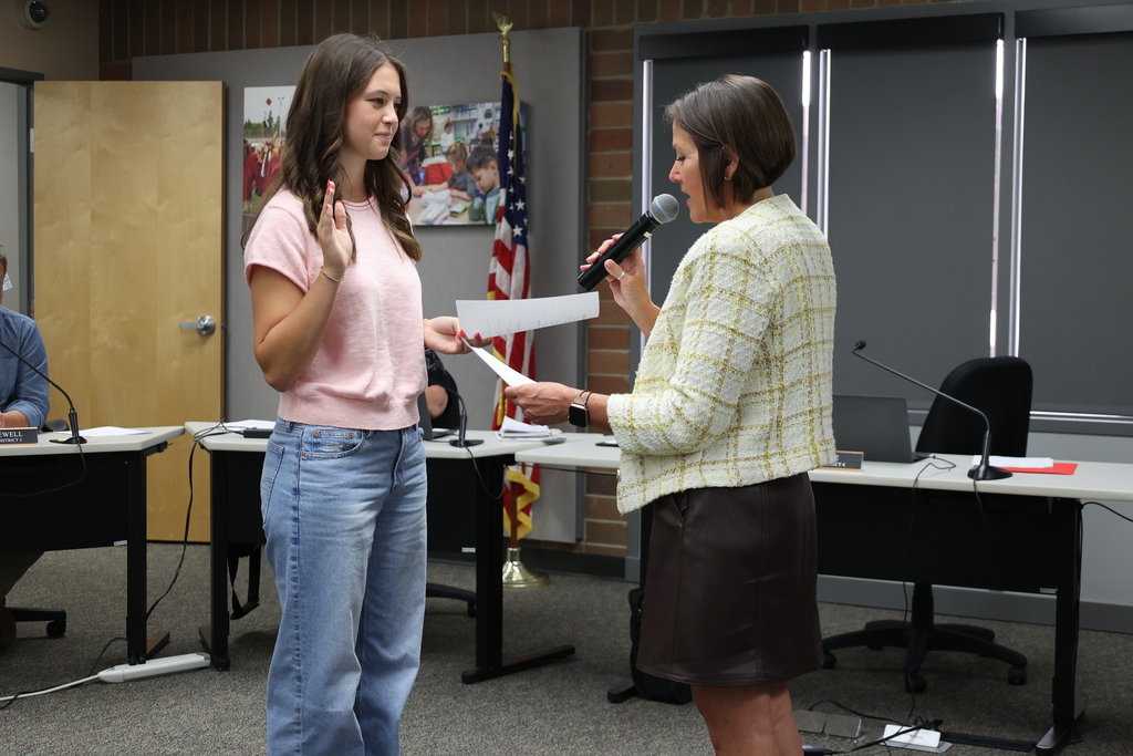 Student representative takes the oath of office to serve on the school board