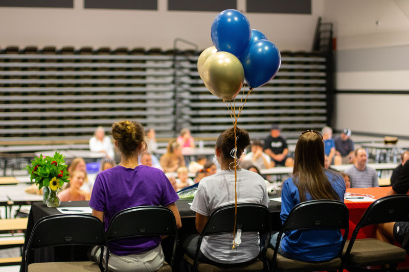 a group of students face the audience on state