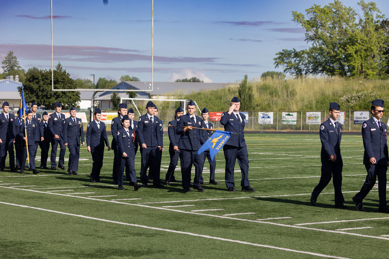 Students march in the pass in review