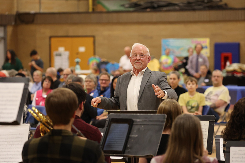 A former band director leads the alumni band