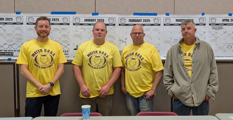 four dads wearing yellow shirts