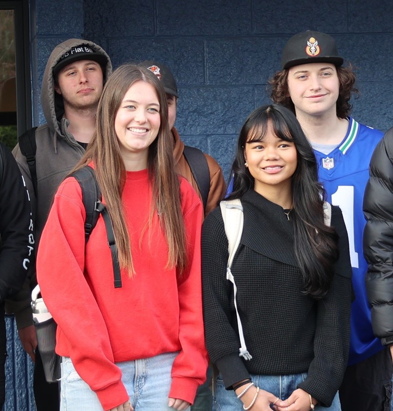 students stand for a photo