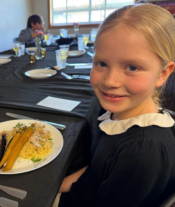 a young girl smiles for the camera