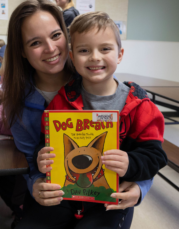 A woman and child smile at the camera