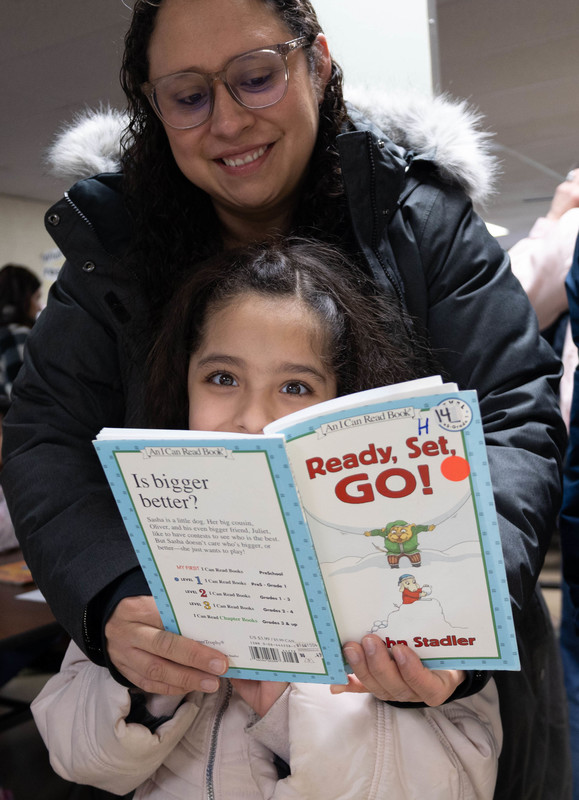 A woman reads to a child
